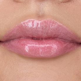YSL Loveshine Plumping Lip Oil Gloss in 1 Thunder Stealer, a sheer rosy pink with high-shine glossy finish, shown on lips