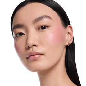 Model with YSL Loveshine Plumping Lip Oil Gloss in 1 Thunder Stealer, wearing rosy blush and natural makeup look