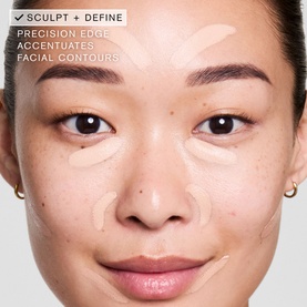 Model with Est&eacute;e Lauder Double Wear Stay-in-Place 24-Hour Concealer applied to face, showing precision edge sculpting and defining contours