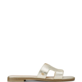 KG by Kurt Geiger Raven Flat Sandals in gold metallic, slip-on style with cut-out strap, logo detail, and tan flat sole