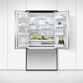 Stainless steel French door fridge freezer with both doors open, revealing fully stocked shelves with fresh produce and drinks
