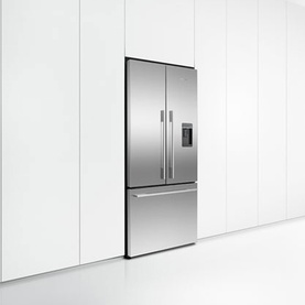 Stainless steel French door fridge freezer with integrated water dispenser, set flush within white cabinetry