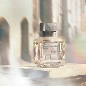 Maison Francis Kurkdjian Petit Matin Eau de Parfum 200ml, clear rectangular glass bottle with gold cap, set against soft architectural backdrop