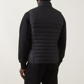 Model wearing Boss Green Label Water Repellent Gilet in black, padded finish, stand-up collar, shown from behind over black sweatshirt.