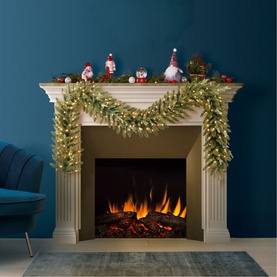 Puleo Arcadia Pre-lit LED Garland 9ft draped over white fireplace mantel, decorated with festive gnome figures and warm white lights