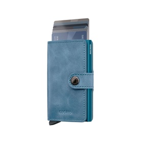 Secrid Vintage Leather Mini Wallet in teal with dark hardware, button closure, aluminium Cardprotector case with cards visible