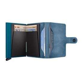 Secrid Vintage Leather Mini Wallet in teal, open to show aluminium Cardprotector with slide mechanism and card slots, fold-over button closure