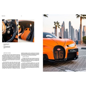 New Mags Iconic Cars book open to spread featuring orange Bugatti Chiron supercar photographed in Dubai with city skyline