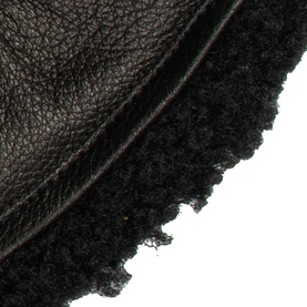 Dents Shrewsbury Lined Gloves in black grained leather with curly shearling lining detail, close-up view