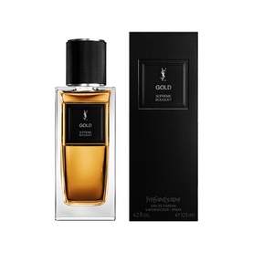 YSL Le Vestiaire des Parfums Gold Eau de Parfum bottle with black cap alongside black gift box packaging