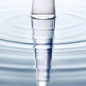 Issey Miyake L'Eau d'Issey Eau de Parfum Intense 50ml clear glass bottle reflected on rippling water surface