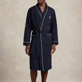 Model wearing Ralph Lauren Pony Player Logo Robe in navy with white contrast piping at cuffs and placket, self-belt closure and embroidered pony logo