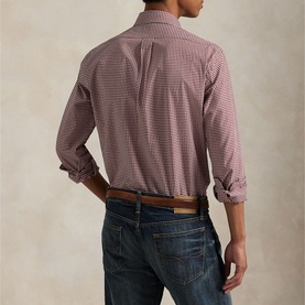Model wearing Ralph Lauren Gingham Check Stretch Shirt in wine, back view, styled with dark jeans and brown leather belt