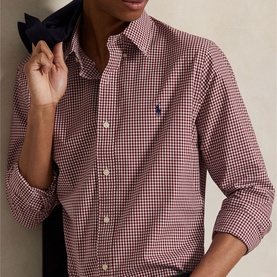 Model wearing Ralph Lauren Gingham Check Stretch Shirt in wine, featuring button-down collar and embroidered Pony logo at chest