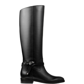Jimmy Choo Lawton Knee-High Boots in black leather with harness knotted strap, silver logo emblem, round toe and flat block heel