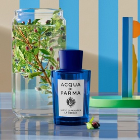 Acqua di Parma Mirto di Panarea La Riserva Eau de Parfum 50ml, blue glass bottle styled with myrtle botanicals and colourful geometric props