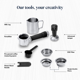 DeLonghi Dedica Duo Cold Brew accessories in silver including portafilter, milk jug, tamper, ESE filter, measuring spoon and steam wand needle.