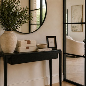 Mindy Browne Andrea Decorative Box Two-Piece Set in cream and brown faux-leather, styled on a black console table with vase and mirror.