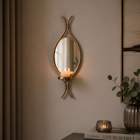 Mindy Browne Claude Mirror Single Wall Sconce in gold, oval mirrored frame with curved iron surround and candle holder, wall-mounted
