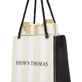 Vondels Brown Thomas Shopping Bag Glass Tree Decoration with gold glitter bow, black rope handles, and cream stripe design.
