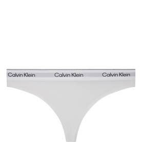 Calvin Klein Icon Logo Thong in white with elasticated logo waistband, mid-rise cut, smooth stretch fabric finish