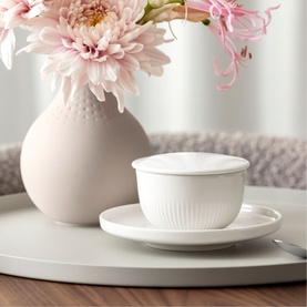 Villeroy & Boch Afina Coffee Cup Saucer 14cm in white premium porcelain with ring relief detail, styled on tray with pink flowers