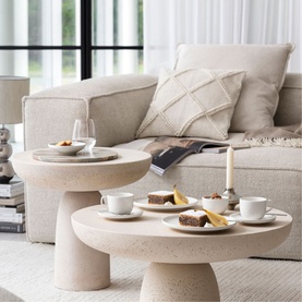Villeroy & Boch Afina Coffee Cup Saucer 14cm in white premium porcelain, styled on a round travertine coffee table in a neutral living room setting