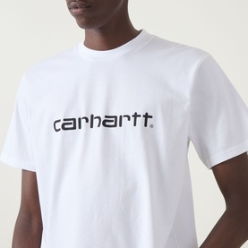 Model wearing Carhartt Script Logo T-Shirt in white with black logo lettering on chest, crew neck, short sleeves.