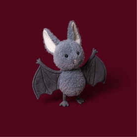Jellycat Broox Bat 22cm grey plush soft toy with outstretched wings, cream inner ears, and black bead eyes