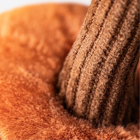 Jellycat Ooky Jack O Lantern 10cm orange plush soft toy, close-up showing fluffy texture and ribbed detail in warm burnt orange tones.