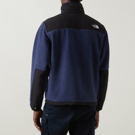 Model wearing North Face Retro Denali Fleece Sweatshirt in Summit Navy/Black, rear view showing contrast panels and high neck zip