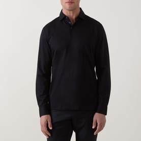 Model wearing Boggi Milano Pima Polo Shirt in black, long-sleeve, three-button placket, polo collar, paired with dark trousers
