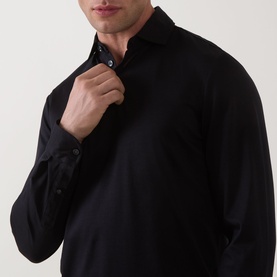 Model wearing Boggi Milano Pima Polo Shirt in black, long-sleeve style with polo collar and three-button placket with dark buttons.