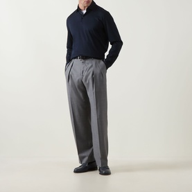 Model wearing Boggi Milano Fine Knit Polo Shirt in navy blue with grey pleated trousers and black leather shoes.