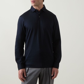 Model wearing Boggi Milano Fine Knit Polo Shirt in navy blue, long sleeves, classic collar with button fastening, paired with grey trousers.