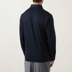 Model wearing Boggi Milano Fine Knit Polo Shirt in navy blue, rear view, long sleeves and classic collar visible, styled with grey trousers.
