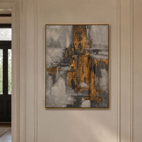 Mindy Browne Lyra Wall Art in grey and gold, abstract canvas in gold frame, displayed on a neutral hallway wall