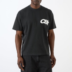 Model wearing Cole Buxton T-Shirt in Vintage Black with small CB logo graphic on chest, styled with dark jeans