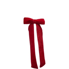 Red velvet hair bow clip with long trailing ribbon tails, shown on white background