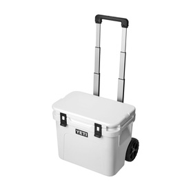 Yeti Roadie&reg; 32 Wheeled Cooler Box in white with retractable periscope handle extended and NeverFlat wheels visible