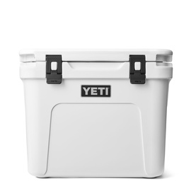 Yeti Roadie&reg; 32 Wheeled Cooler Box in white, front view showing black latches, LipGrip handles and YETI logo badge