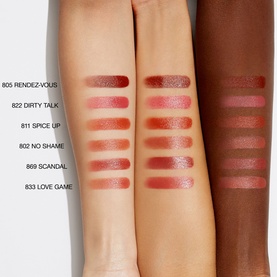 NARS Explicit Lipstick shade swatches in six shades including Scandal, shown across three skin tones on forearms