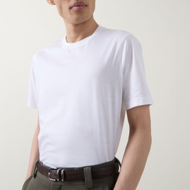 Model wearing Boggi Milano white cotton T-shirt with crew neck, styled with olive trousers and brown leather belt.