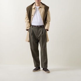 Model wearing Boggi Milano white cotton T-shirt, styled with beige trench coat, khaki trousers, and dark loafers.