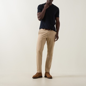 Model wearing Boggi Milano Solid Logo T-Shirt in navy blue with beige chinos and brown suede shoes.