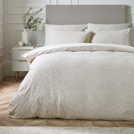 Catherine Lansfield Corded Leaves Duvet Set in Champagne Gold, featuring subtle leaf texture, styled on a bed with matching pillowcases