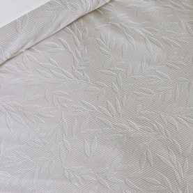 Catherine Lansfield Corded Leaves Duvet Set in gold, close-up showing tonal leaf jacquard texture on champagne fabric