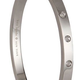 Kate Spade Silver Crystal bracelet, slim silver-tone bangle with three clear crystal embellishments and engraved brand logo interior