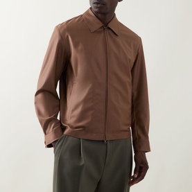 Model wearing Boss Black Casual Wing Zip Jacket in medium brown with point collar and concealed zip, styled with olive trousers