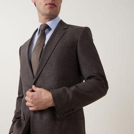 Model wearing Boss Black Casual Single-Breasted Suit Jacket in dark brown with notched lapels, styled with light blue shirt and brown tie
